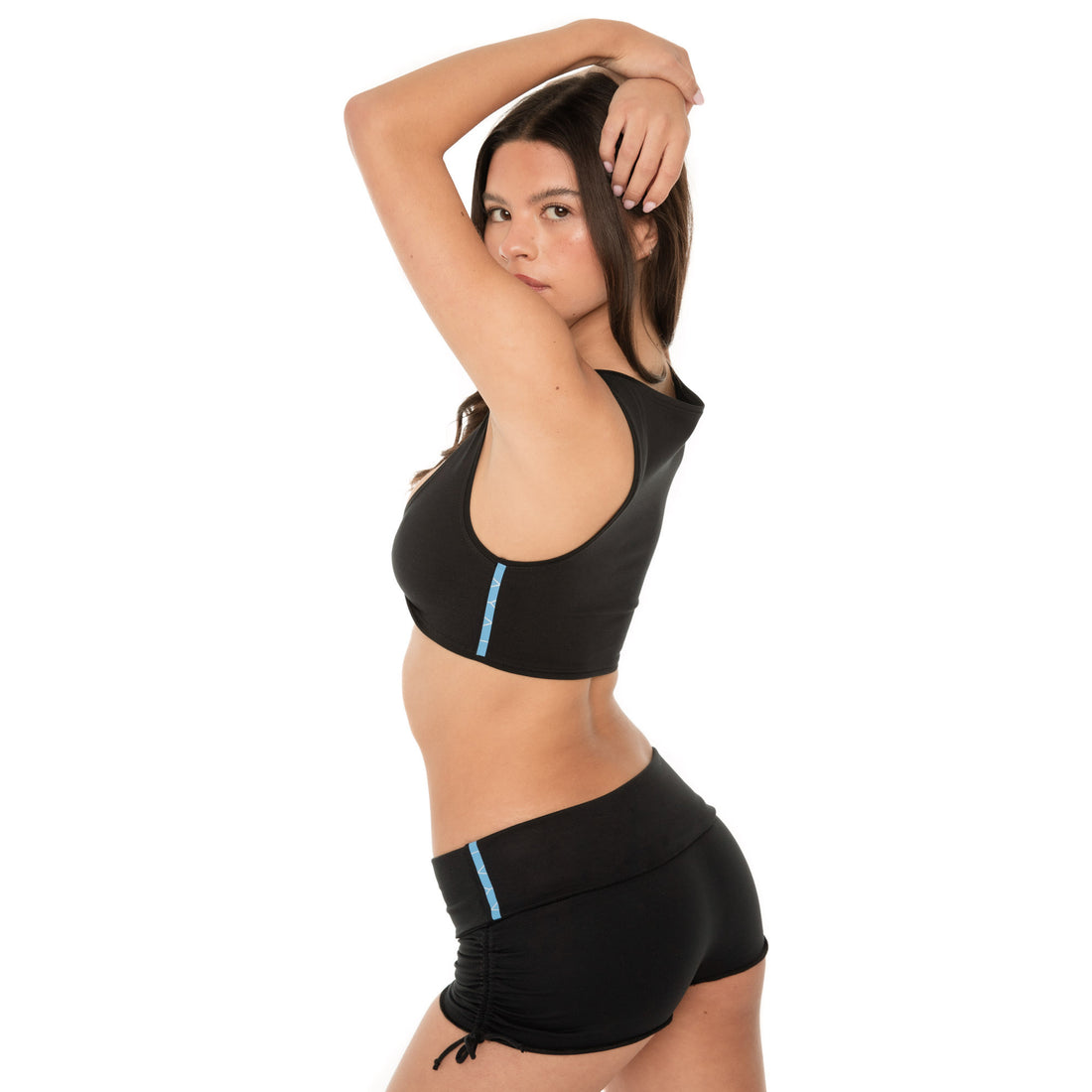 Back view of black active crop top and side-tie shorts **black