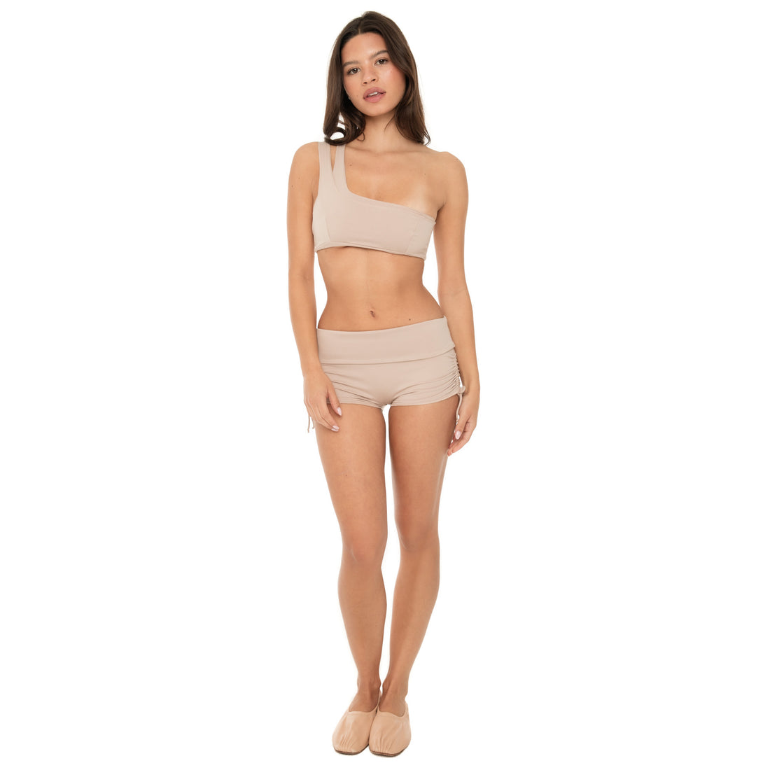 Model wearing Minik Short in nude with low-rise fit and adjustable side tie **nude