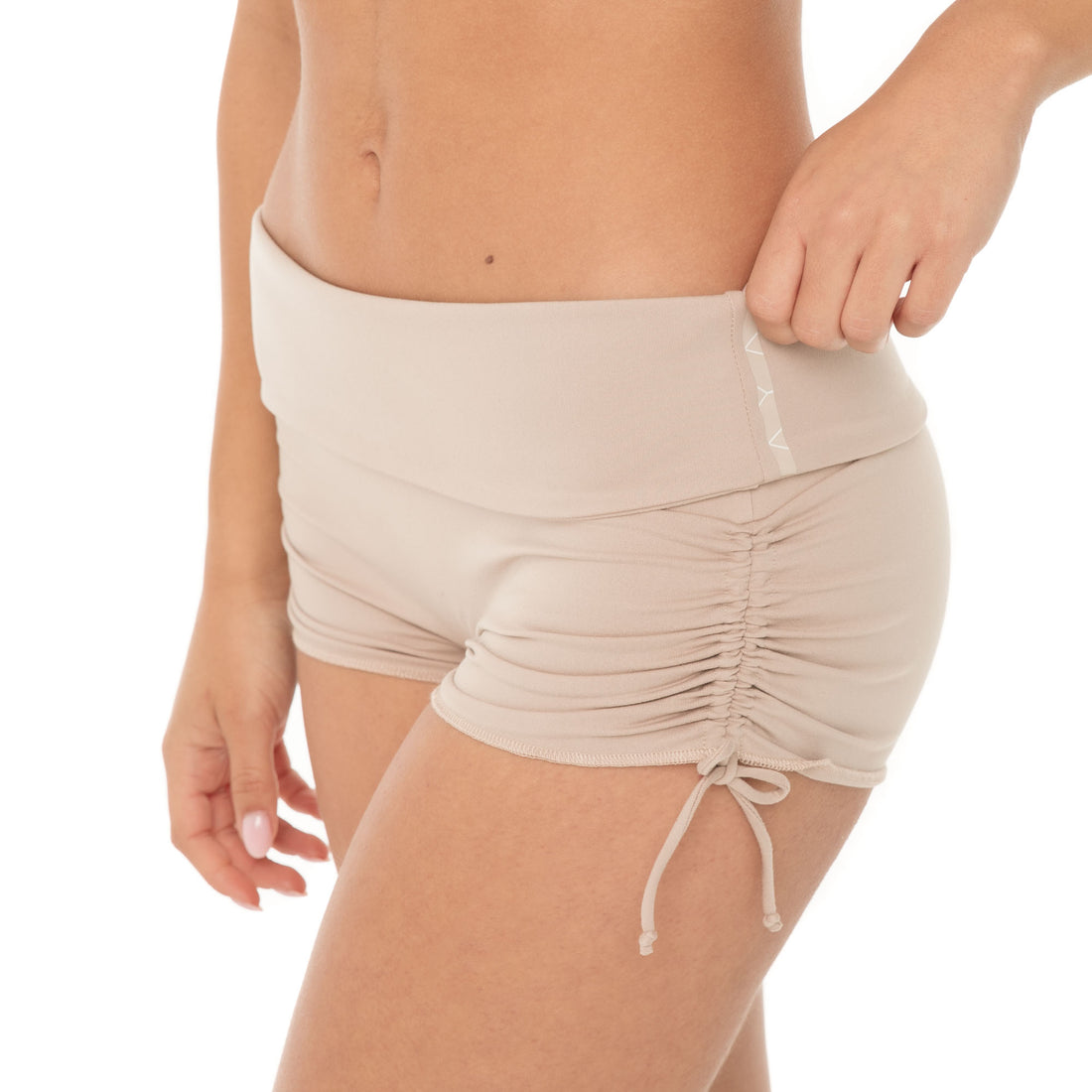 Close-up of Minik Short in nude showing matte fabric and adjustable side ruching **nude
