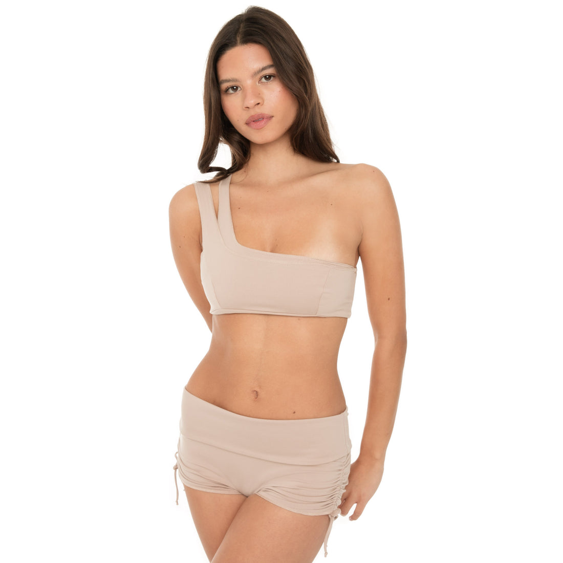 Three-quarter view of Minik Short in nude showing second-skin fit and stretch **nude