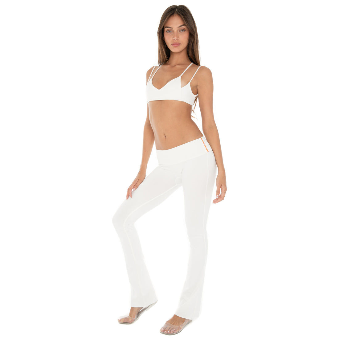 Model wearing Senna Pant – low rise flare pants, Are You Am I **white