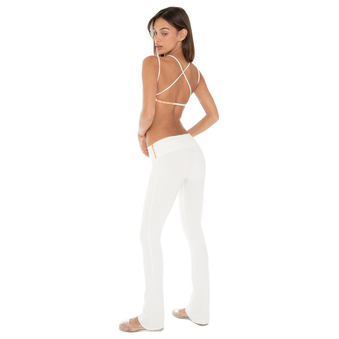 Model wearing Senna Pant – low rise flare pants, Are You Am I **white