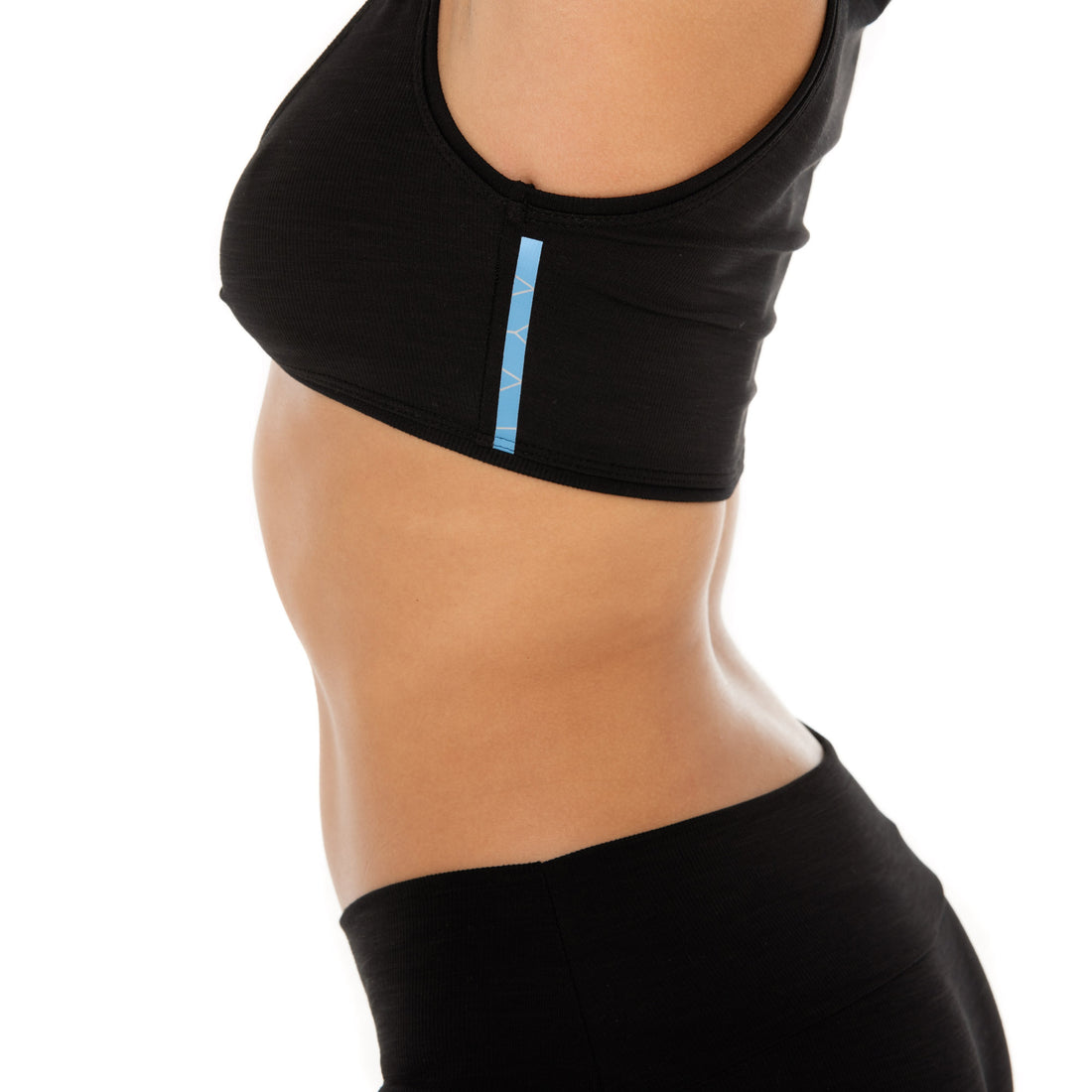 Side view of Alue Top in black showing contoured fit and active ribbed texture **black