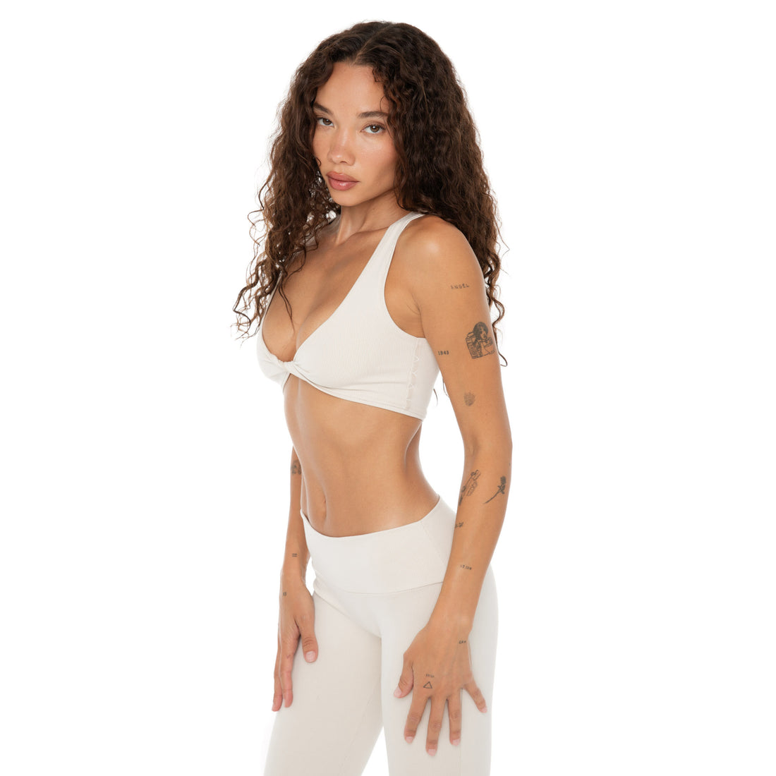 Side angle of Are You Am I Alue Top in sand, supportive twist-front detail **sand