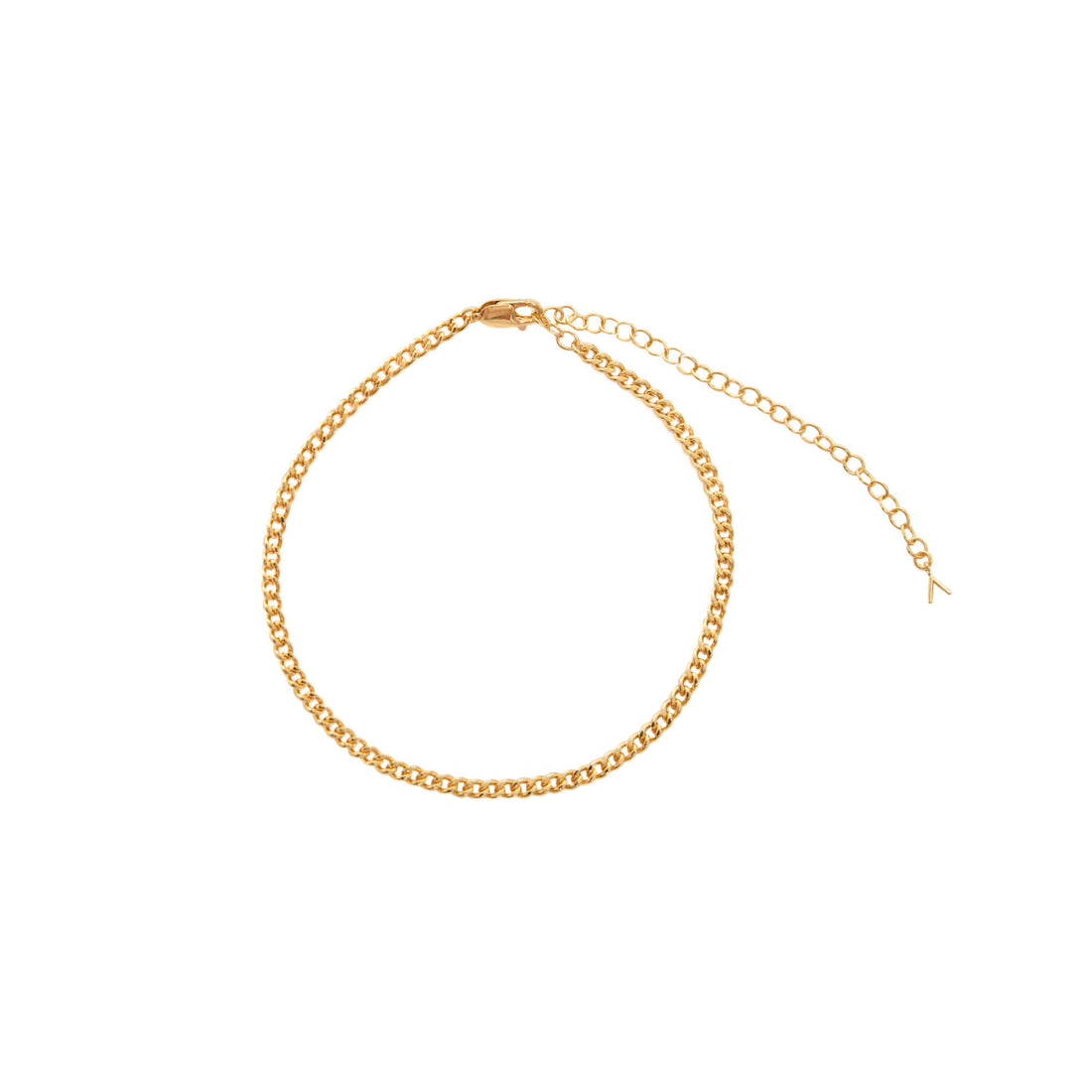 Gold Baby Binx anklet with a curb chain design and adjustable clasp, laid in a circular shape against a white background.
