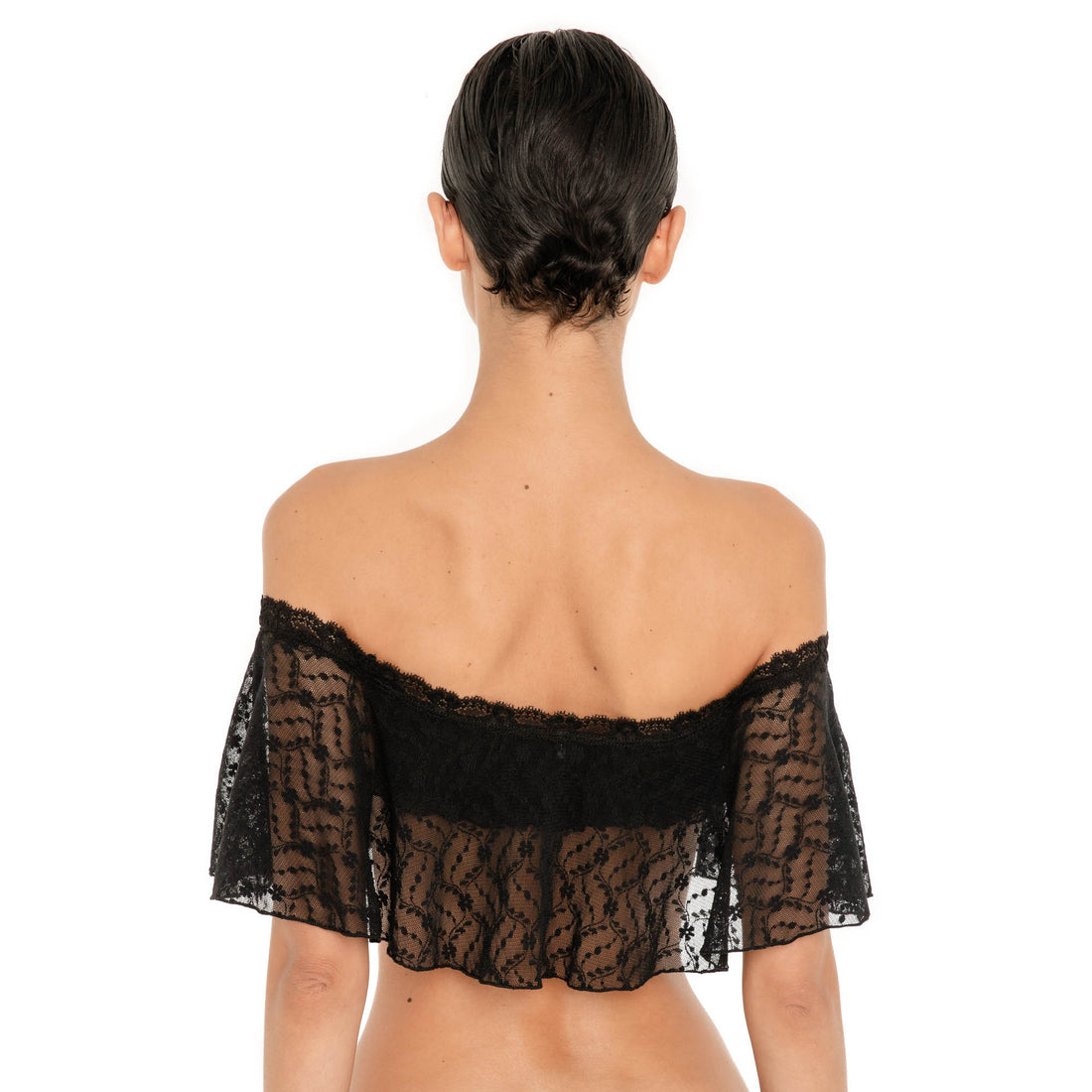 Back view of the Liulu Top in black sheer lace with a wide off shoulder neckline and cropped ruffle hem **black