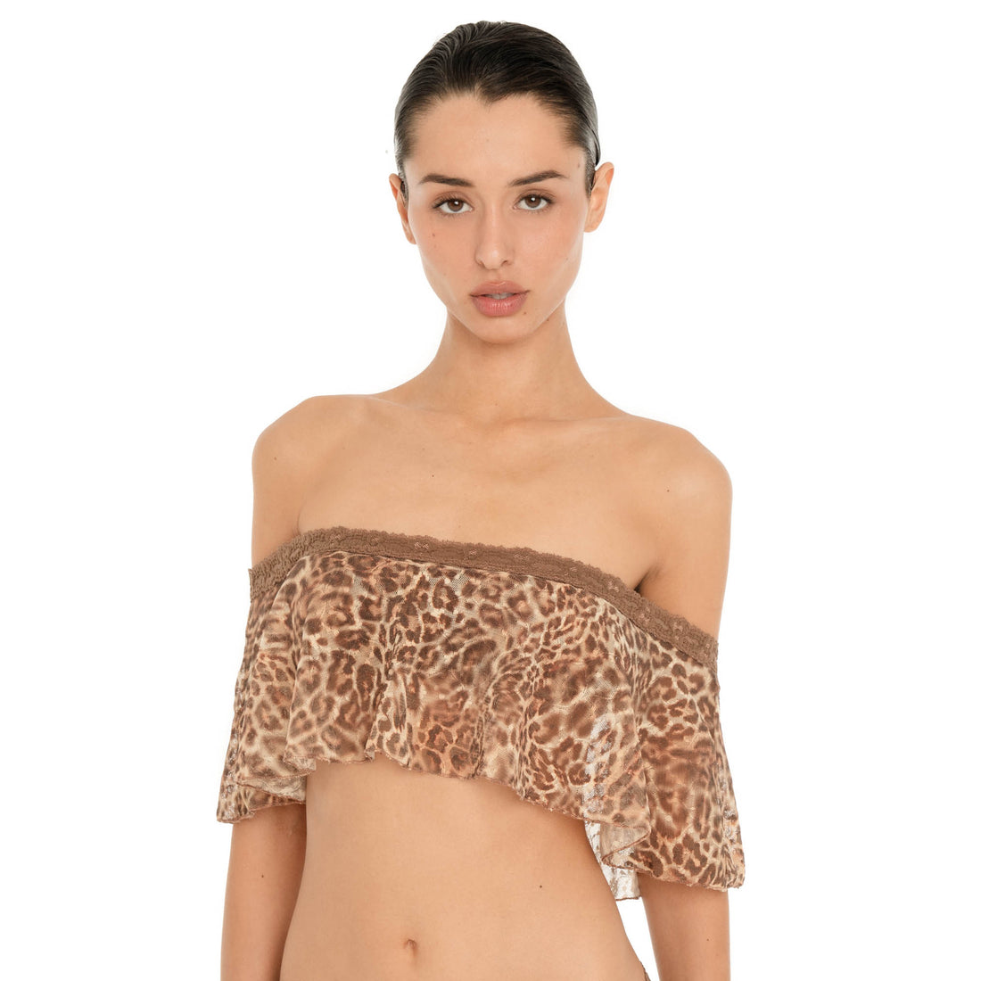 Close front view of the Liulu Leopard Top, highlighting the brown lace trimmed off shoulder neckline, semi sheer leopard print fabric and wide flowing ruffle