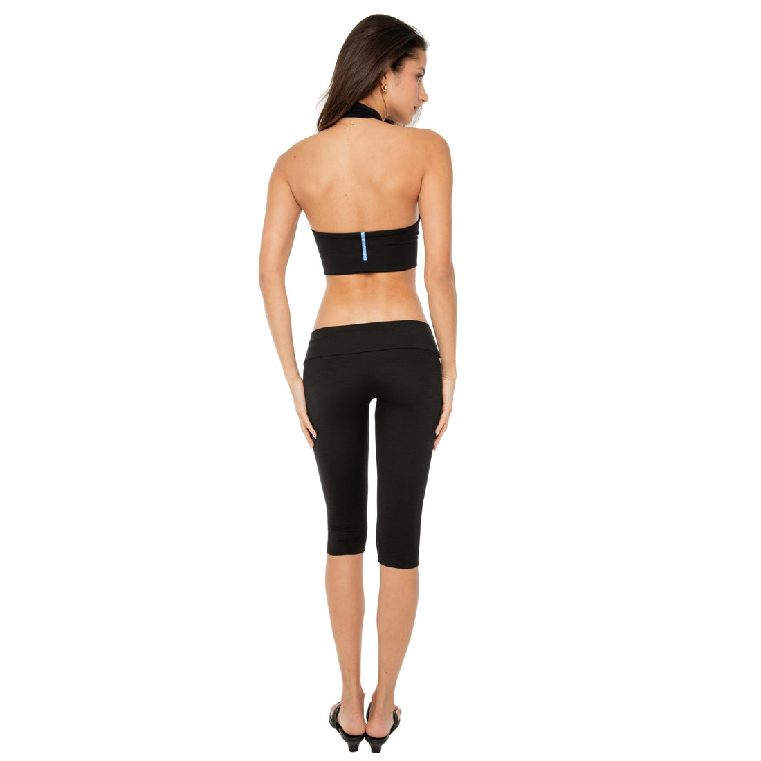 Rear angle of black Clio Capri in activewear styling**black
