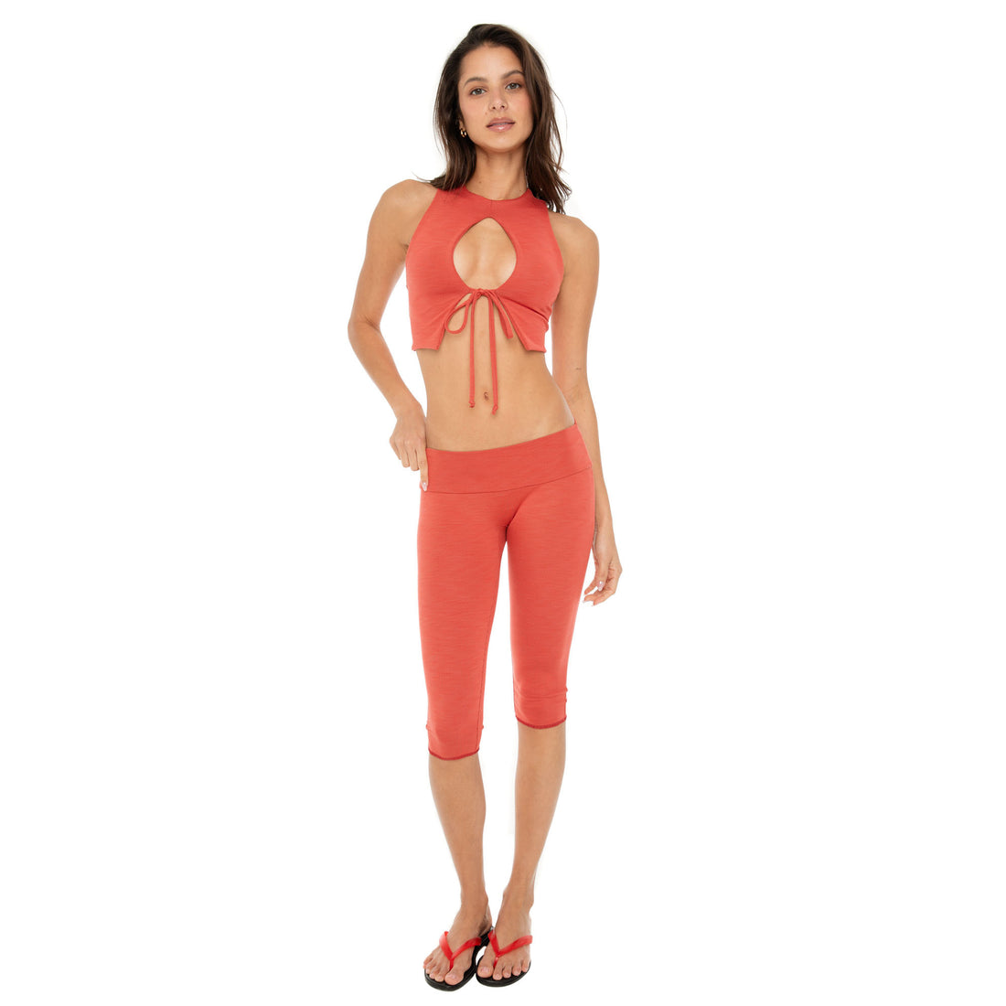Full front view of Clio Capri leggings in cyeanne with matching crop top**cayenne