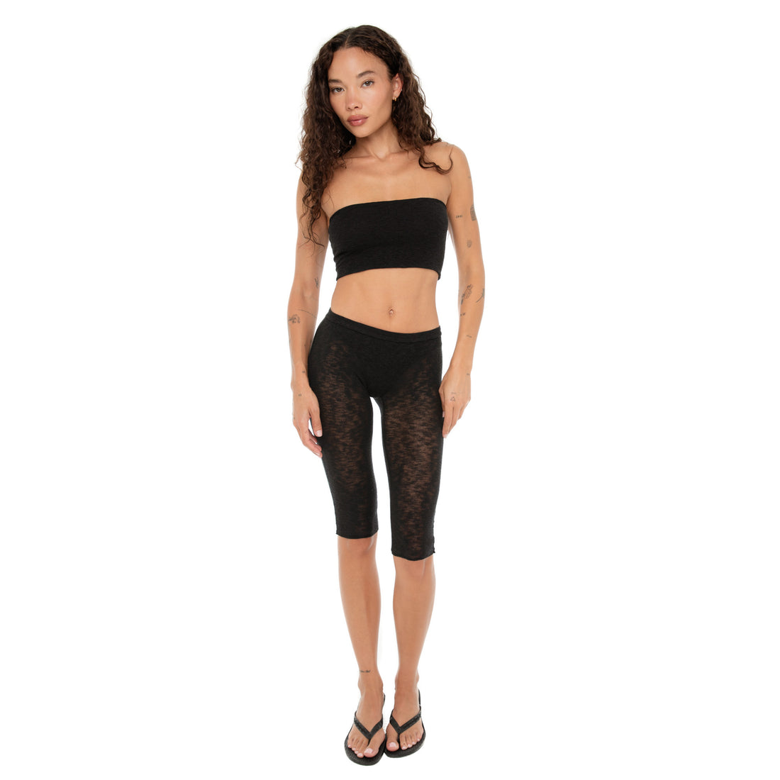 Model wearing the black Aili Tube and matching sheer leggings, standing front-facing **black