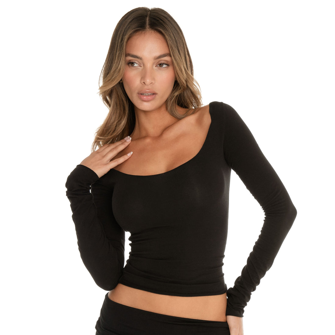 Detail view of the neckline and shoulder line of a fitted long sleeve top with a soft stretch finish **black