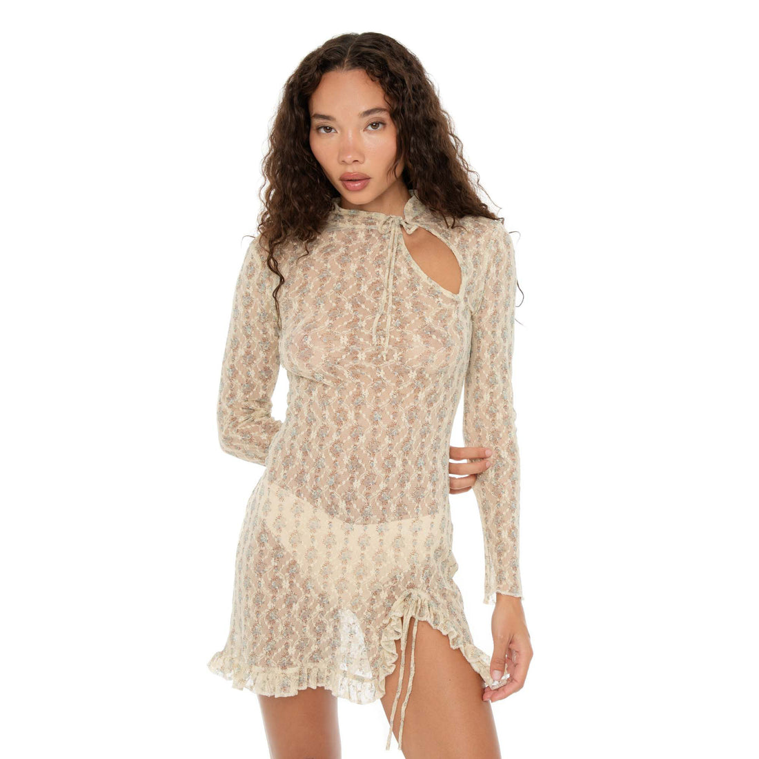 Close-up of Evie Dress in Sky Blossom, sheer lace mini with ruched slit, tie-neck, and ruffle hem detail. **sky blossom