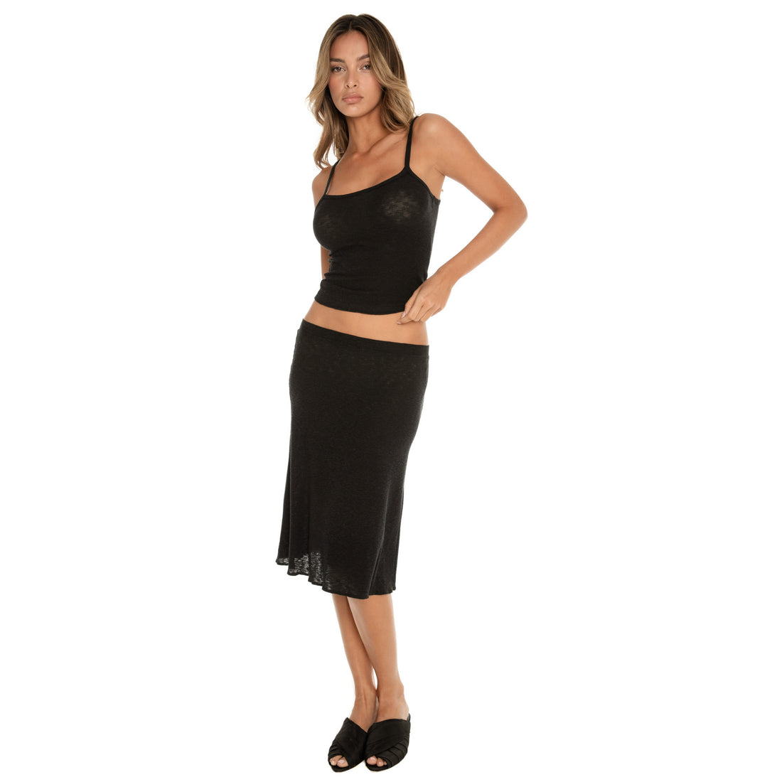 black ribbed midi skirt and tank set, three quarter angle highlighting contour fit and texture **black
