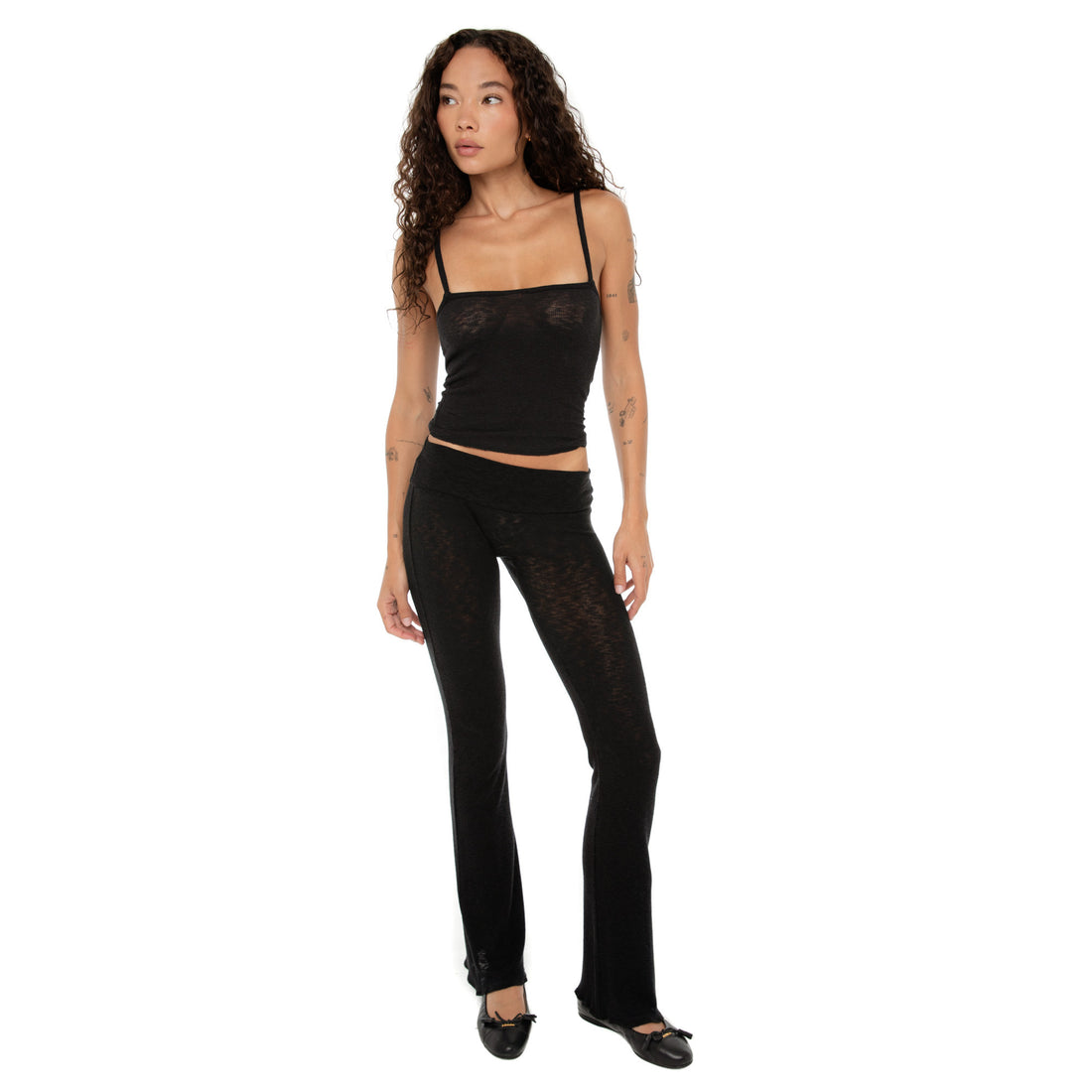 Full front view of the Illi Tank in black styled with matching low-rise leggings. **black