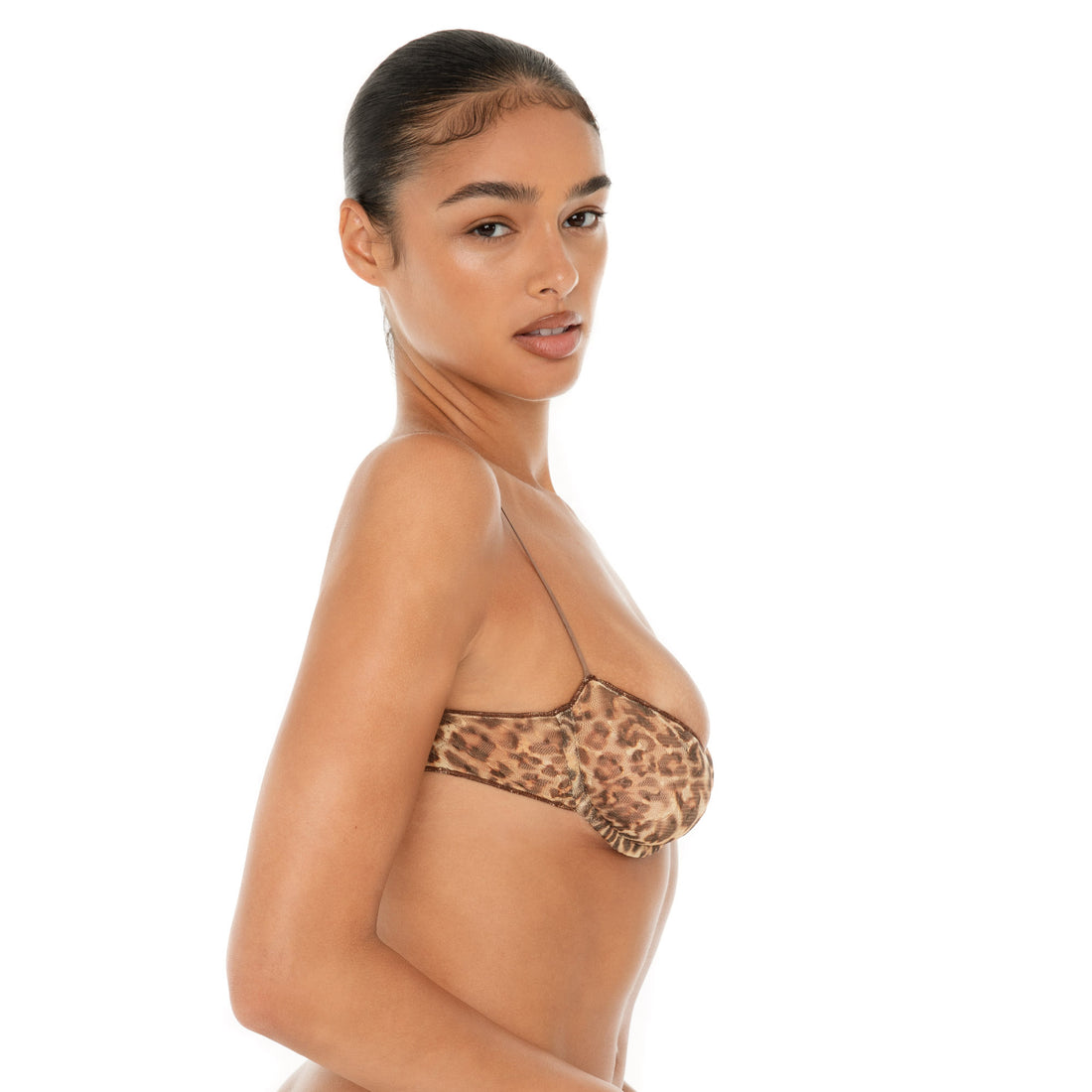 Model wearing the Iselle Bra in vintage floral print — sheer nylon underwire bra with delicate stretch and fine adjustable straps. **leopard