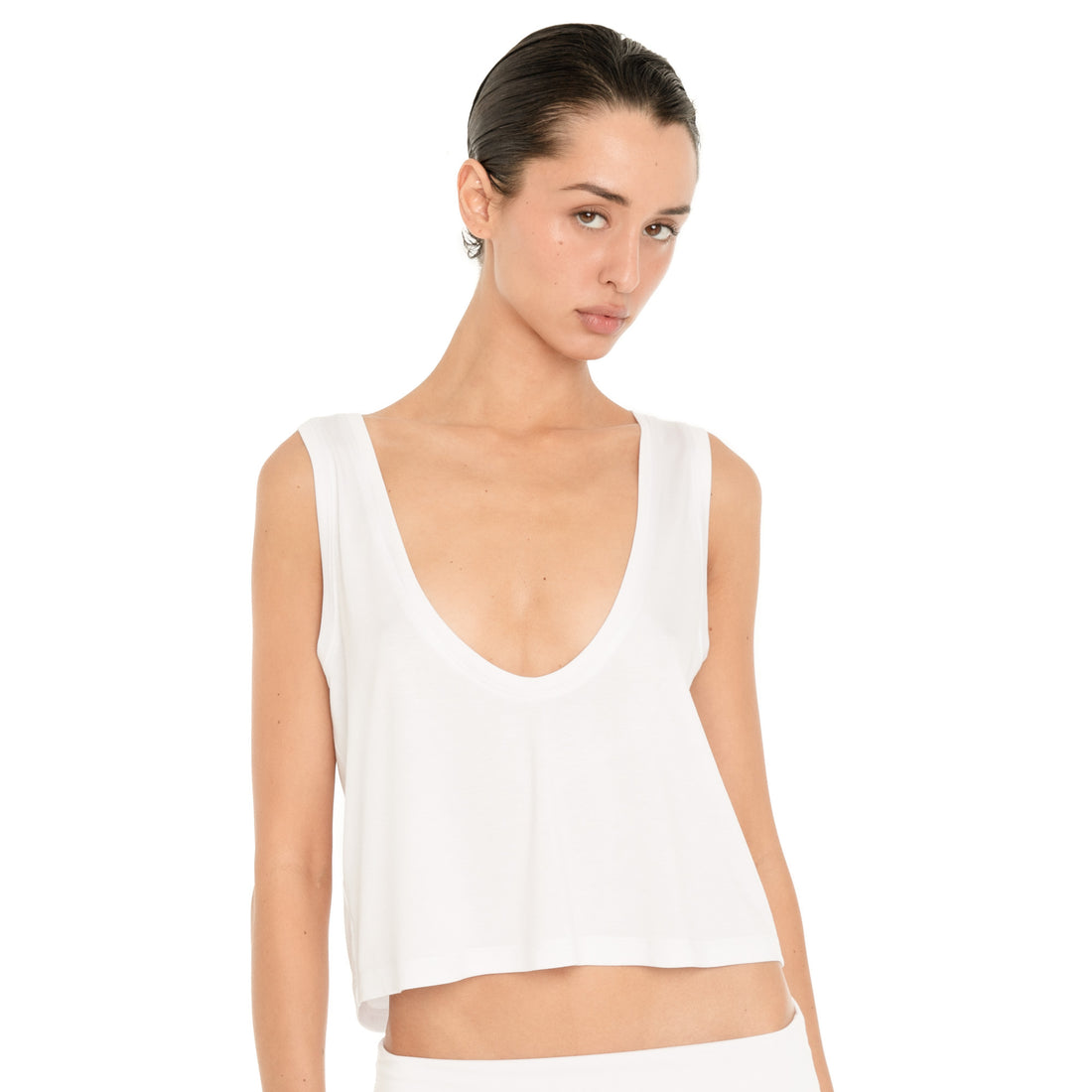 Front close-up of the white Kasia Top, highlighting the deep scoop neckline, wide straps and relaxed fit through the body.**white