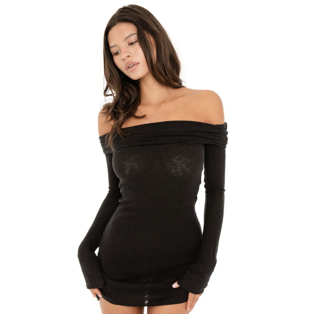 Model wearing the black Kina Dress, showing the sheer lightweight knit, fitted silhouette and mini length **black