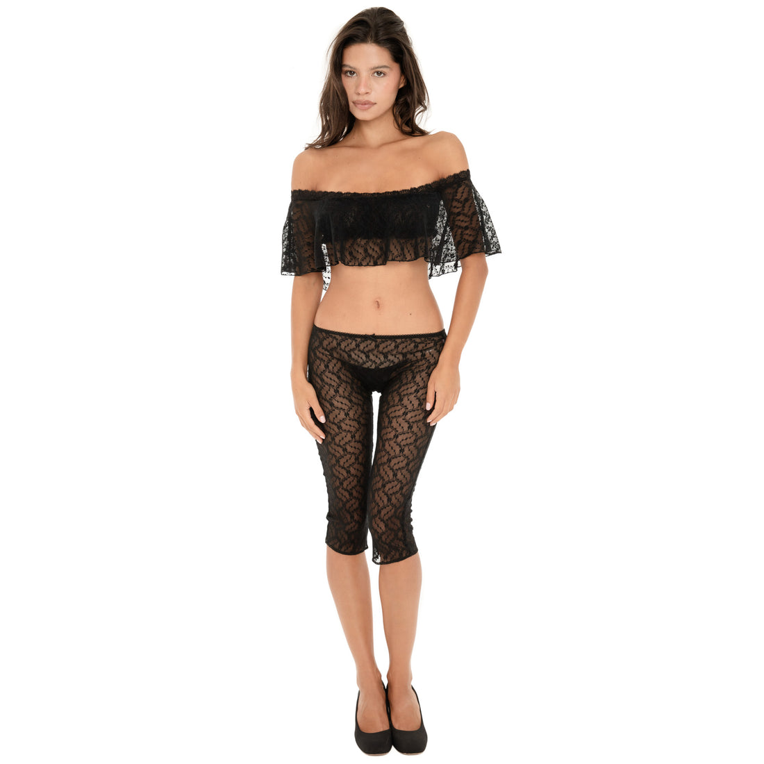 Model wearing ARE YOU AM I Lyli Capri in Black, a sheer floral lace capri with a low-rise fit and delicate lace-trimmed waistband **black