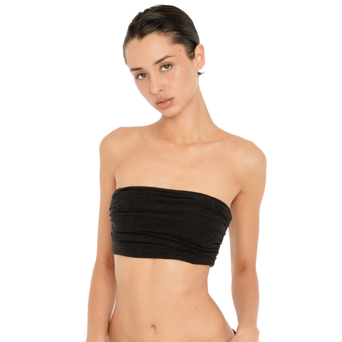 Close front view of model wearing the Meili Bandeau in Black, showing its softly ruched texture and fitted strapless silhouette. **black