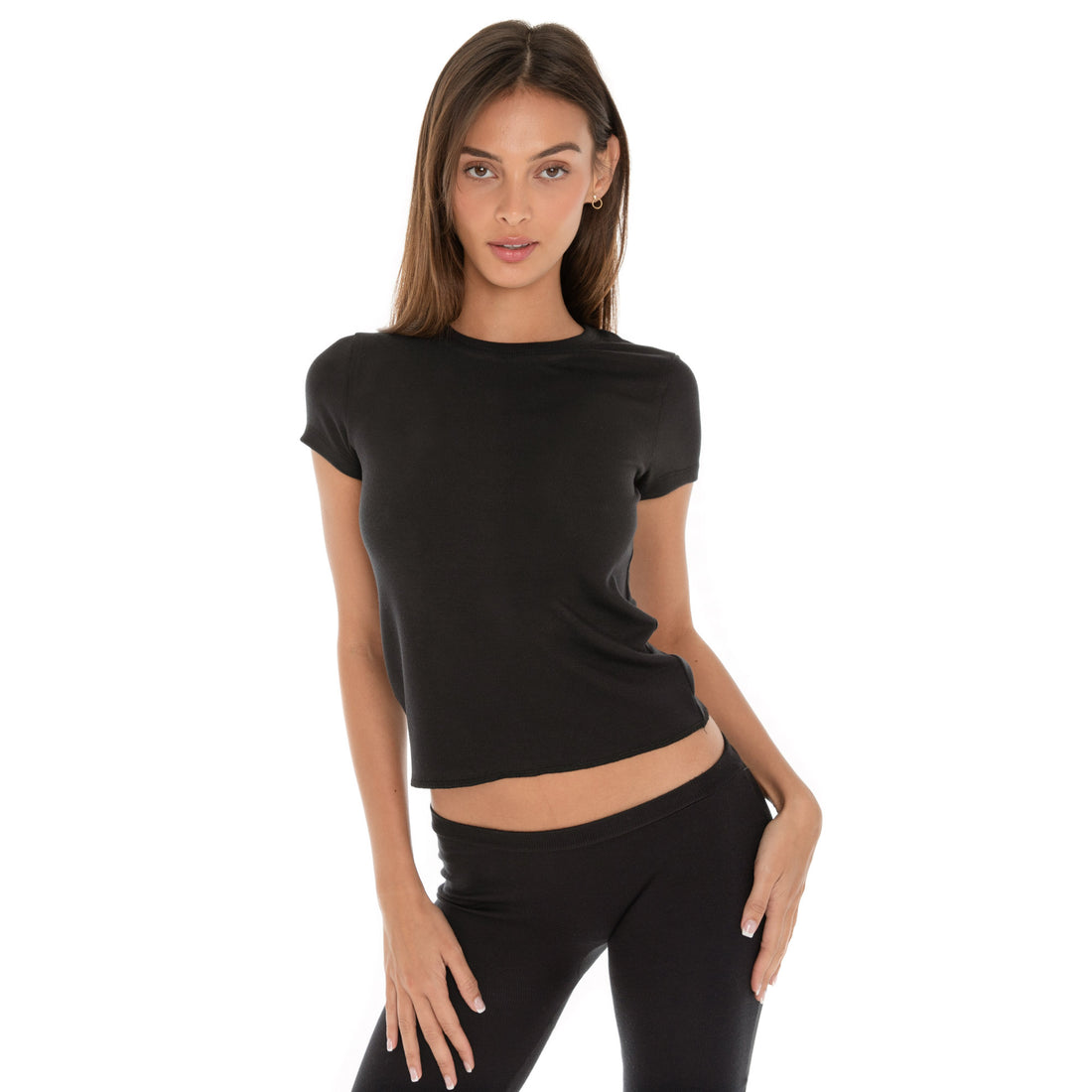 Are You Am I - Miia Capsule. Model in black Miia Tee with short sleeves and slightly cropped fit.
