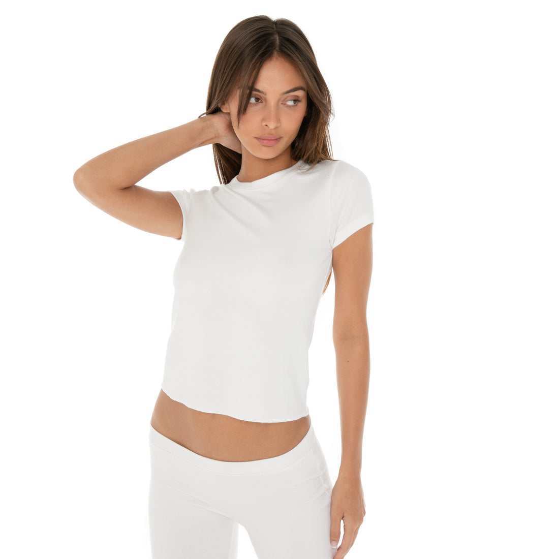 Model in white Miia Tee, slightly cropped fit with short sleeves.