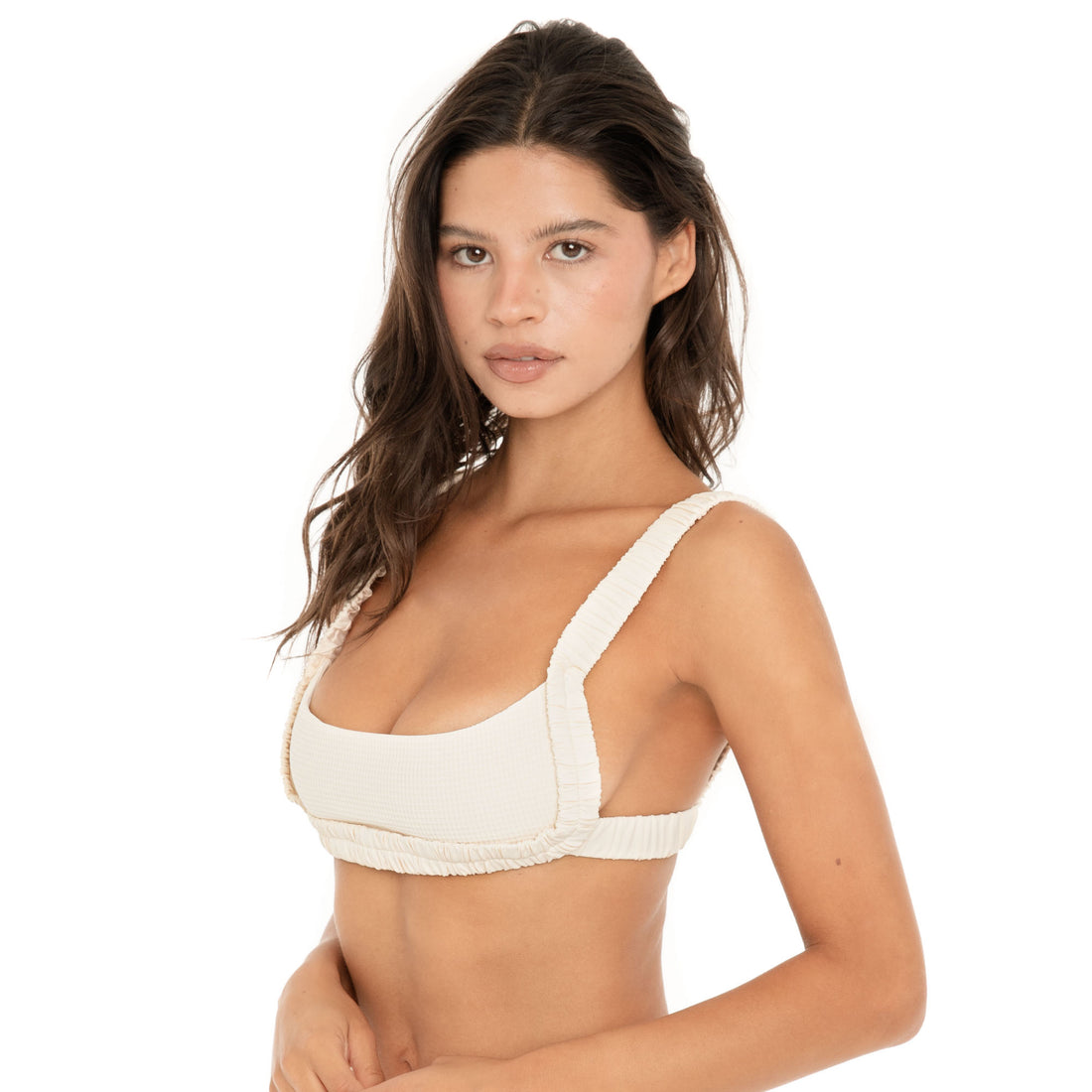 Close-up front view of the Nailah Swim Top in Cream, showing the textured swim fabric, scoop neckline, wide straps, and gathered trim **cream