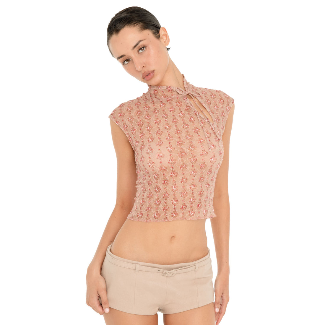 Front three-quarter view of model wearing the Pika Short in Almond, showing the low-slung fit and matching tonal belt. **almond