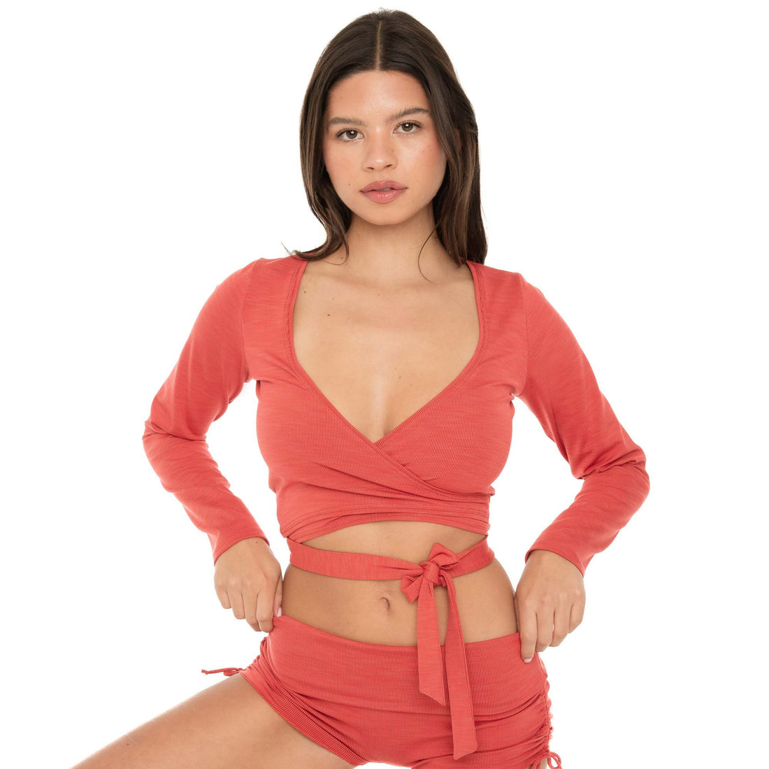 Front detail of Nuka ribbed wrap top in cayenne with adjustable wrap ties **cayenne