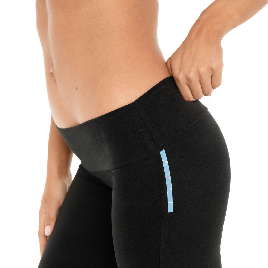Close-up of black Senna Pant showing the low-rise waistband and fitted stretch fabric **black