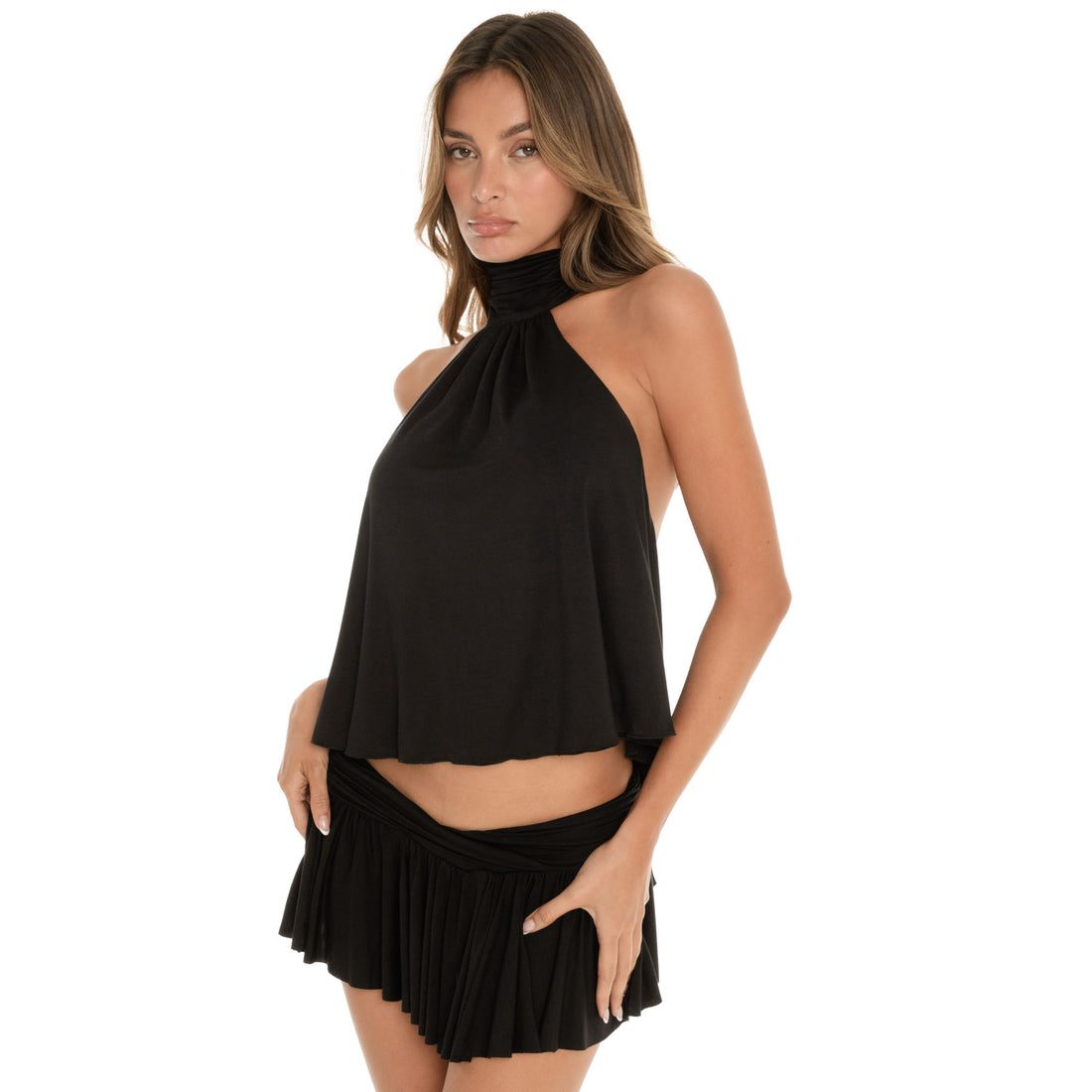 Angled front view of black draped halter top paired with flowy mini skirt **black