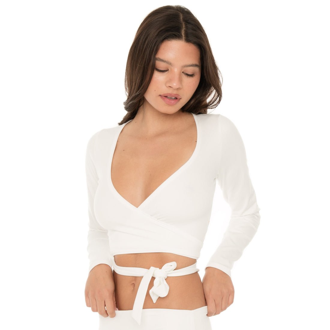 Front view of the white wrap crop top with waist tie detail centered, paired with matching bottoms **white