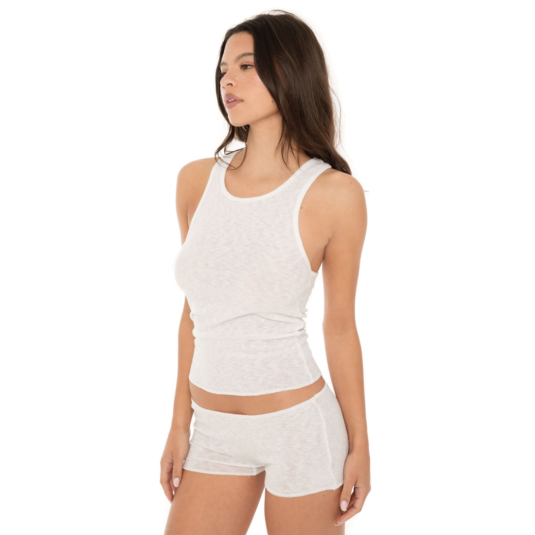 Angle view of white Aili Short showing low-rise fit and stretchy ribbed texture**white