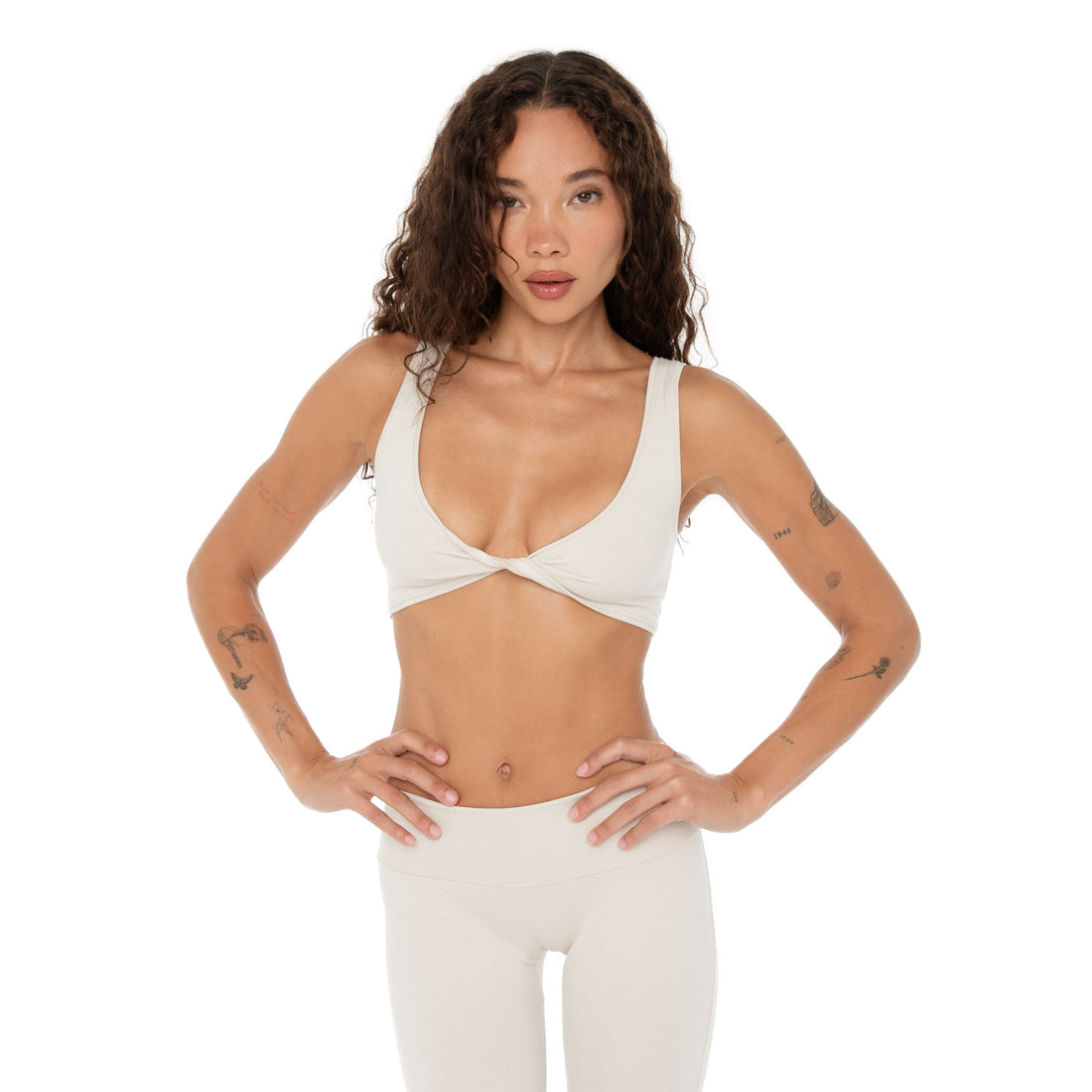 Model wearing Are You Am I Alue Top in sand, flexible ribbed active crop top **sand