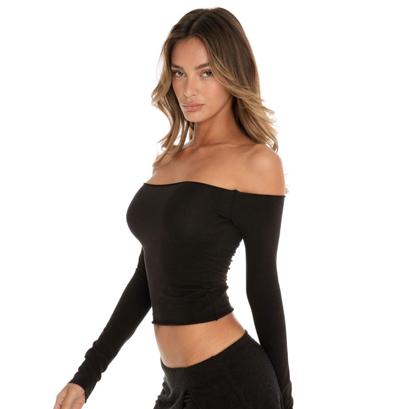 Close-up of model wearing the Anouck Top in black, off shoulder neckline and fitted second-skin jersey, three quarter angle **black