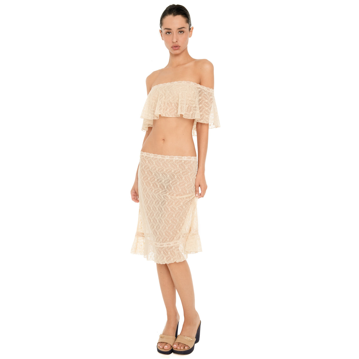 Liulu Top in nude sheer lace, an off shoulder cropped ruffle top, styled with a matching nude lace midi skirt **nude