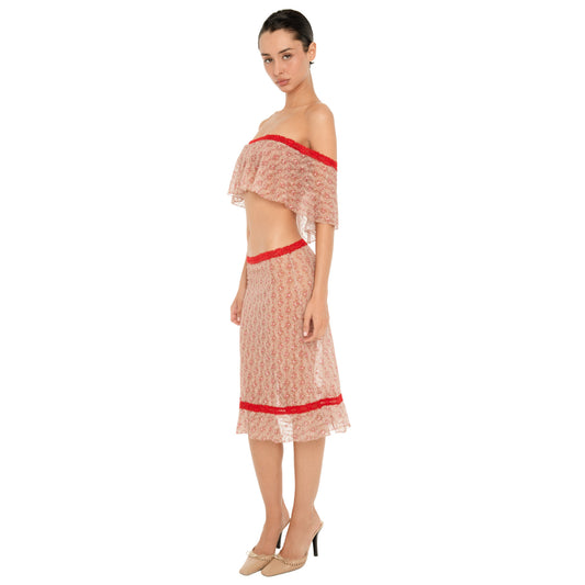 Full-length side three-quarter view of a model wearing the Cherry Blossom Liulu Skirt, showing the sheer floral lace, low-rise fit, red lace trim, and softly ruffled midi hem. **cherry blossom