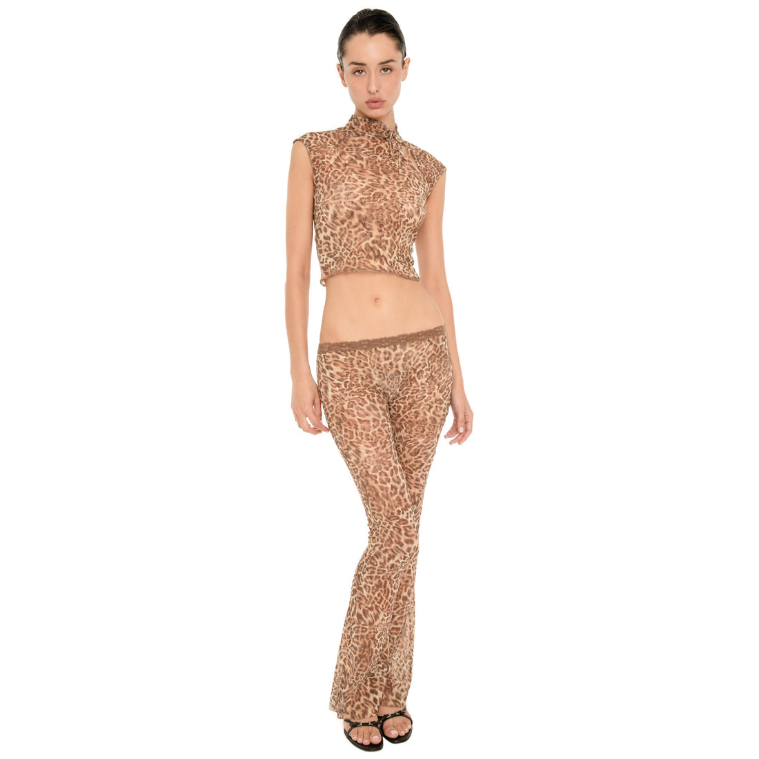 Front view of model wearing the Liani Pant in Leopard, showing the low rise lace-trimmed waistband and sheer leopard fabric.