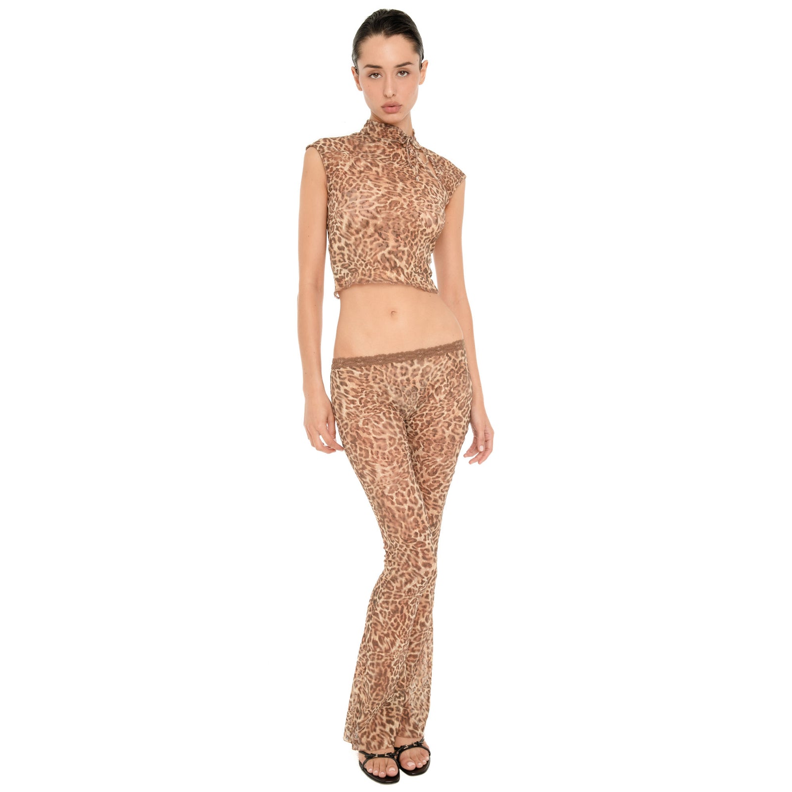 Front view of model wearing the Liani Pant in Leopard, showing the low rise lace-trimmed waistband and sheer leopard fabric.