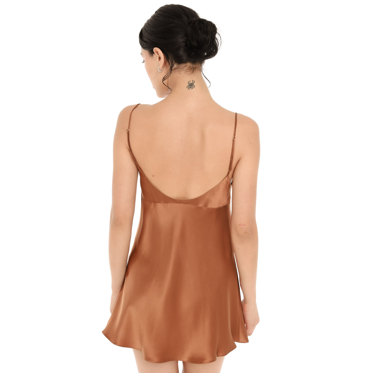 Back view of the copper silk Eisling Dress, showing the low scoop back and thin straps with small gold adjusters. **copper