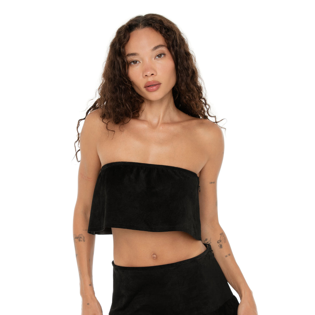 Close-up of model wearing the suede top, highlighting texture and structure. **black