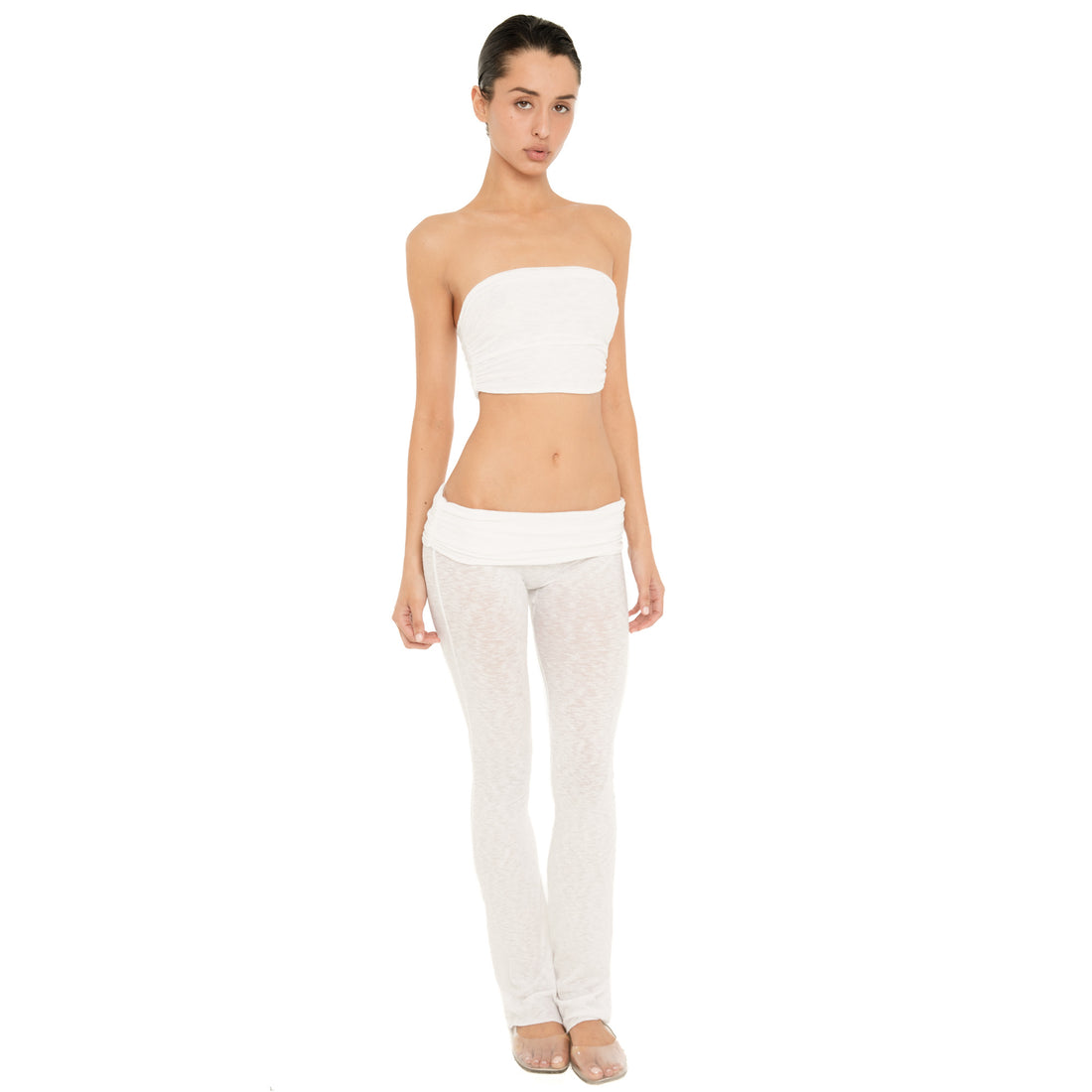 Front view of model wearing the Meili Pant in White, showing the low slung fit, wide ruched fold-over waistband and semi-sheer fabric. **white
