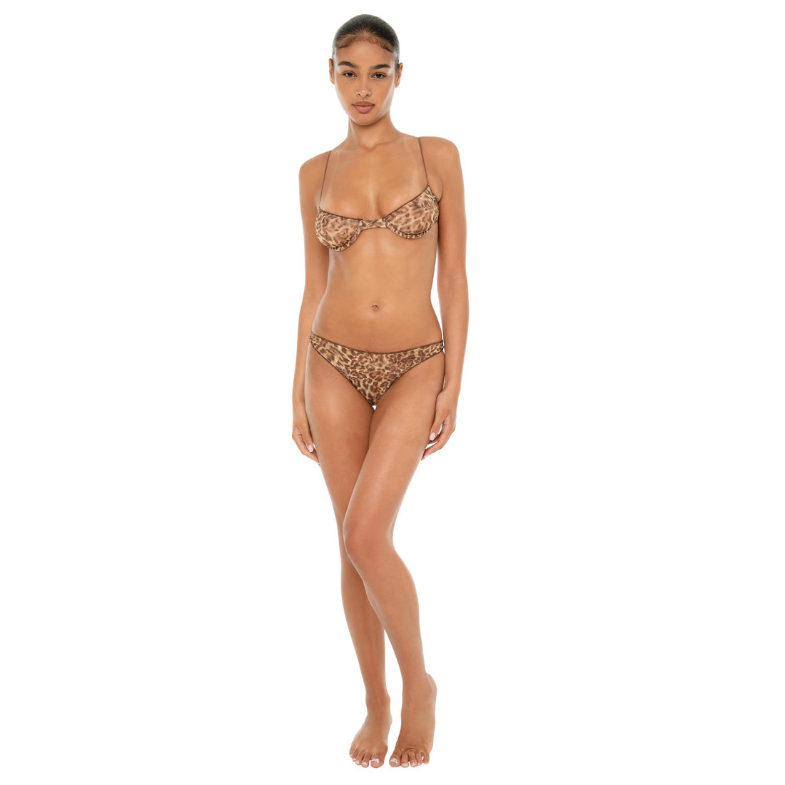 Model wearing the Iselle Bra in vintage floral print — sheer nylon underwire bra with delicate stretch and fine adjustable straps. **leopard