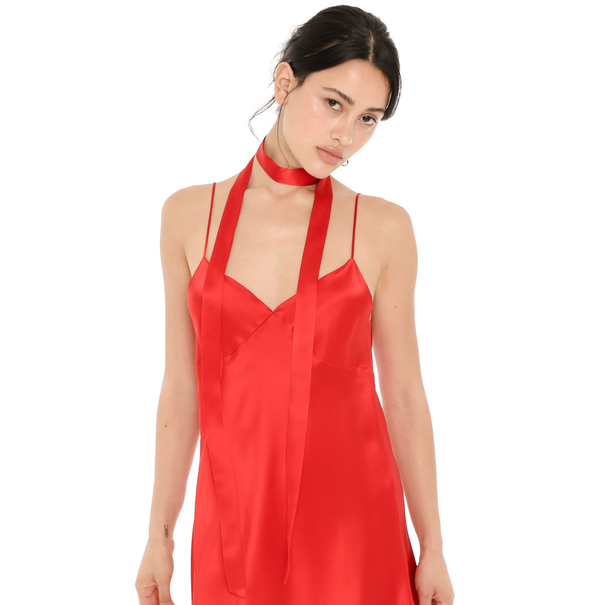 Model wearing the Isolde Scarf in cherry red silk, wrapped once around the neck with both long ends hanging down the front of the matching cherry red silk Eisling Dress. **cherry red