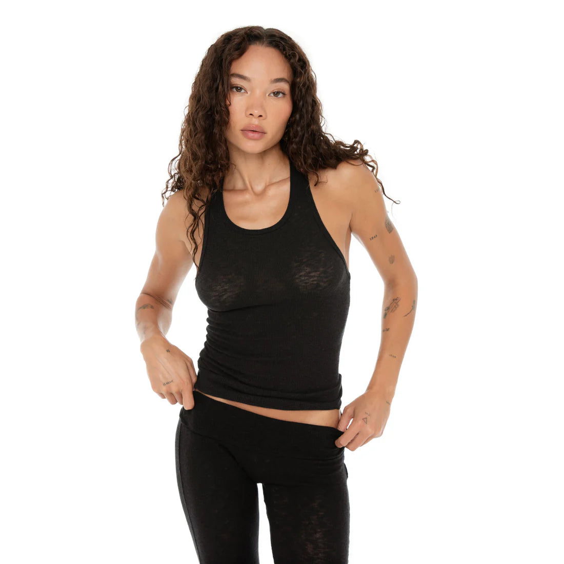 Are You Am I - Kimi Multipack. Model in black Kimi Tank with matching leggings.