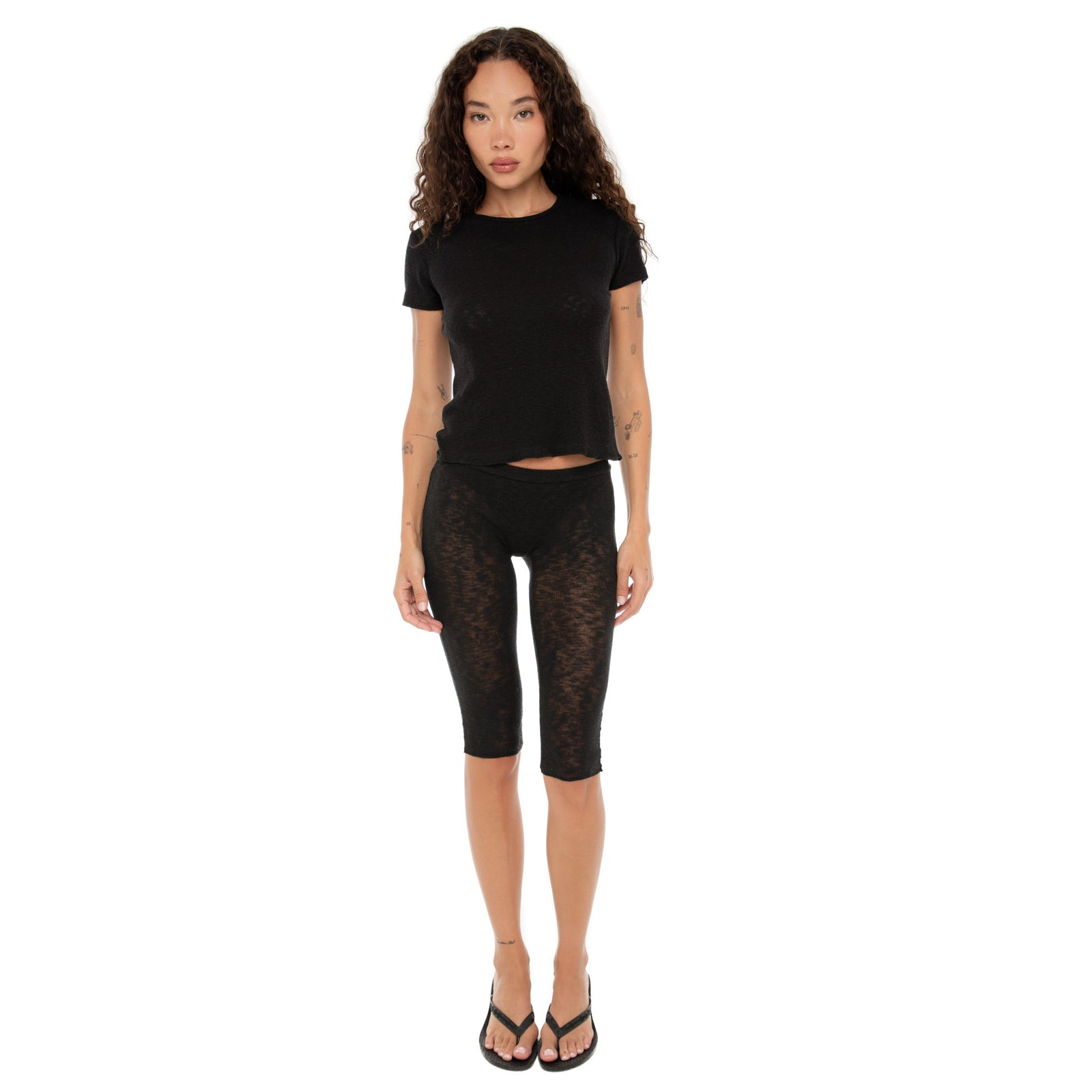 Model wearing Are You Am I Kimi Tee in black, fitted baby rib short sleeve top. **black