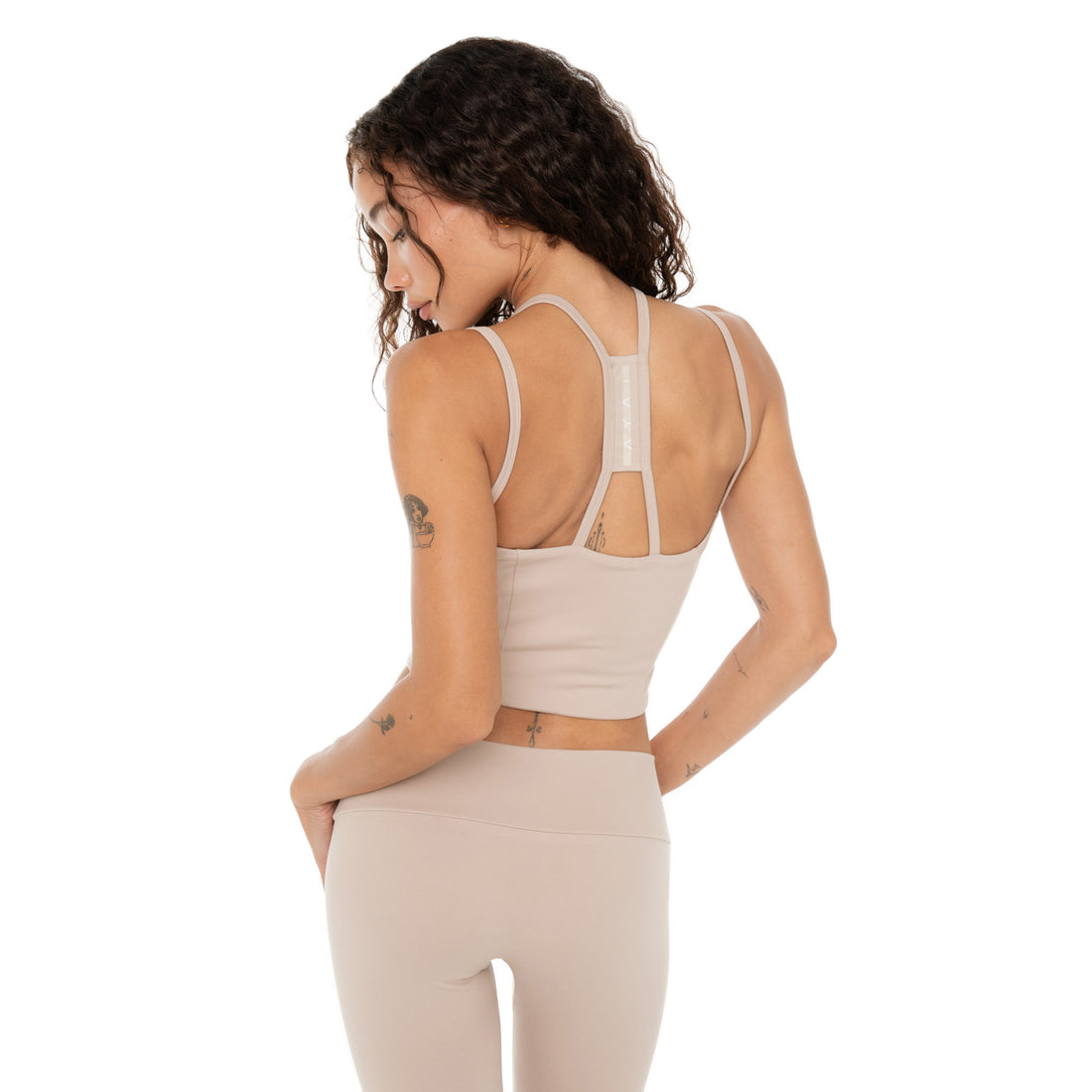 Back view of nude Kylen Top with racerback design in stretch active fabric. **nude
