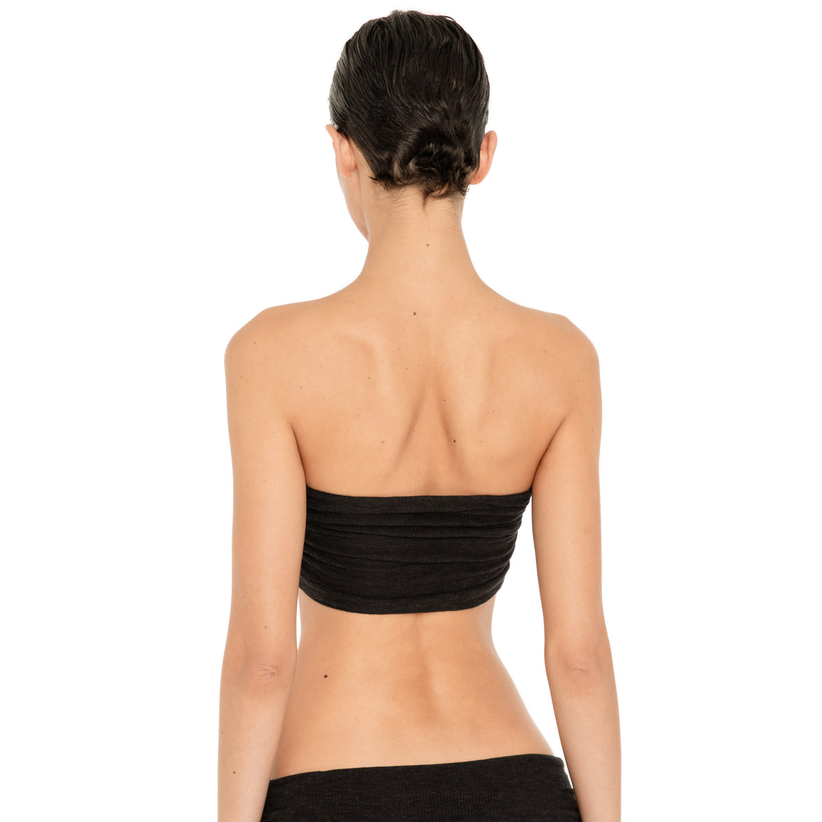 Back view of the Meili Bandeau in Black, showing the straight strapless back and all-over horizontal ruching. **black