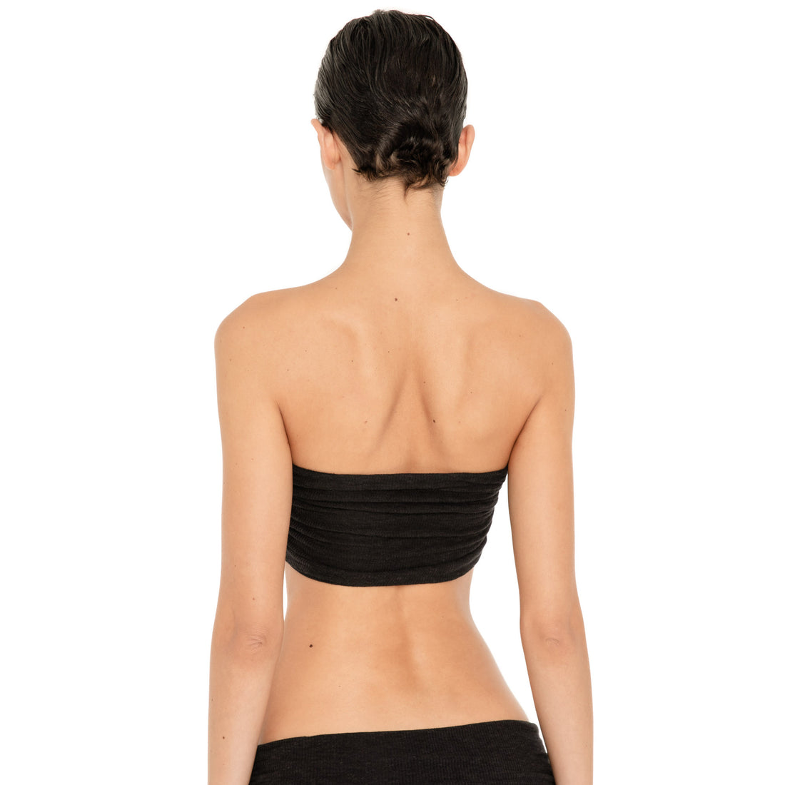 Back view of the Meili Bandeau in Black, showing the straight strapless back and all-over horizontal ruching. **black