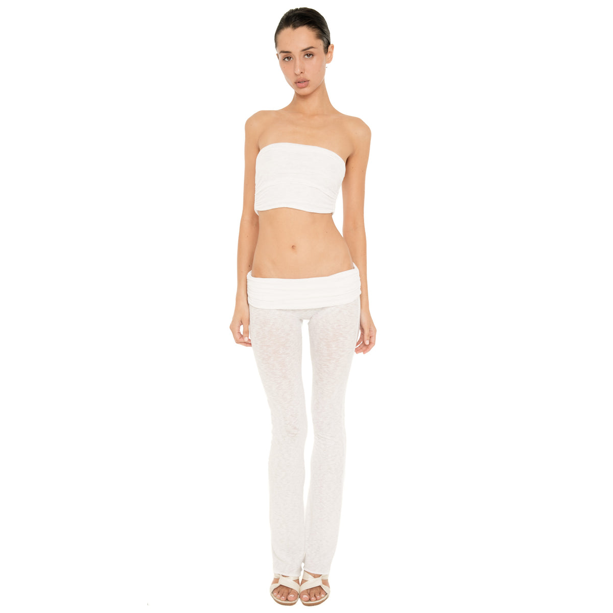 Full-length front view of model wearing the Meili Bandeau in White with matching low rise sheer pants, showing the cropped strapless silhouette and ruched texture. **white