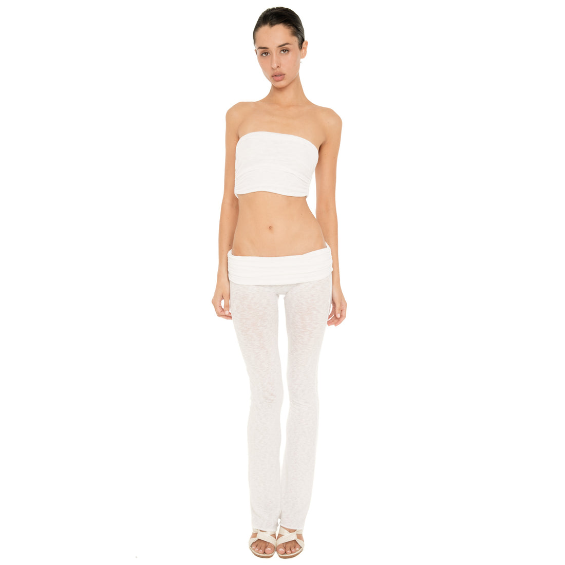 Full-length front view of model wearing the Meili Bandeau in White with matching low rise sheer pants, showing the cropped strapless silhouette and ruched texture. **white